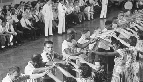 Patients in a mental hospital square-dancing.